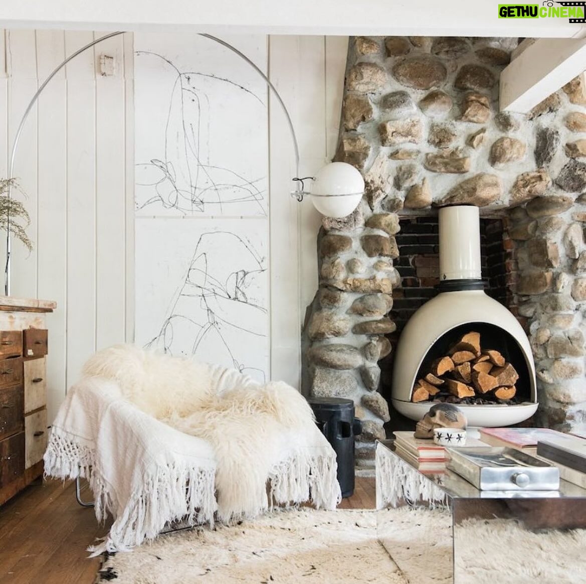 Leanne Ford Instagram - Want to hear something crazy- This fireplace was made from scratch. There was no fireplace when I got #thelittlecabininthebigcity! But there was the ghost of one on the outside wall. There were also loads of beautiful stones out in the yard. Are you thinking what I’m thinking?! Presto. A new/old fireplace was born! The #malm fireplace inside was my creative way to make it safer while meshing my many styles in this little place. // #LeanneFordInteriors shot by @tessaneustadt