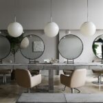 Leanne Ford Instagram - When we started this project we asked ourselves, “How can we create a salon that feels more like an art installation?” Sarah, the owner of the salon, planned on a large single table centered down the middle of the space. Since the table would be the main focal point in the entire salon (and would be visible from the Main Street) we knew we wanted to create something special. We found crates of incredible salvaged stone in Ohio from @rbxcle and that was the answer. It tied in the gray tones of the walls and the “marbled” floors that already existed in the space. Demetrius and Nick led the charge on Sarah’s team and helped us fabricate this beautiful custom island out of some old forgotten stone tiles. Swipe to get a close up of these salvaged beauties! //#LeanneFordInteriors shot by @erinashkelly and styled @_mon_modern______