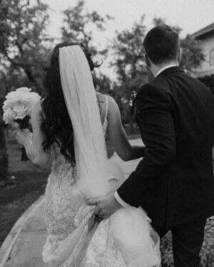 Liana Ramirez Instagram - more… 

photographer: @frannypullenphotography 

•
•
•

wedding planner: @wolferandco / @thejamiewolfer 
florals: @fiftyflowers 
suits: @generationtux 
dresses: @sherrihill 
DJ: @atlastentertaintment 
venue: @canyonwoodridge 
Videographer: @justinruizmedia 
cake: @raynedesserts 
hair & makeup: @sammiezavala @heyhaleybray @makeupartistveronica 
champagne flutes: @elenahonch 
food: @tuscanoitalian 
staffing: @ambianceeventstaffing 
rentals: premiereeventstx