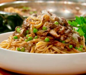 Lidia Bastianich Instagram - Spaghetti Caruso.  This easy and simply delicious pasta is named for the famous Italian opera singer, Enrico Caruso, who created it.  It is made with San Marzano tomatoes, mushrooms, peas, onions, and an addition of chicken liver. Always a family favorite, It makes ME want to sing! And I share the secret of choosing the correct pasta shape and cooking it perfectly every time. Link to recipe and video in my bio. Buon Gusto! .
.
.
.
.
#LidiasRecipes #LidiasItaly #LidiasKitchen #LidiaBastianich #ItalianFood #25YearsofLidia #FromLidiasTableToYours #centofinefoods @centofinefoods 
#LidiasSoundtrack