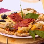 Lidia Bastianich Instagram - If you're planning a family get together this weekend here's some tasty treats perfect to pass around. Join me in Tropea, Calabria, as I prepare some delicious Bruschetta with various toppings, including Ndjua - a spicy paste prepared from cured pork and peppers, traditionally made in the Italian region of Calabria. Buon Gusto! #LidiasRecipes #LidiasItaly #LidiasKitchen #tuttiatavolaamangiare #PartyRecipes #LidiaBastianich #ItalianFood