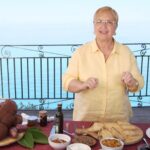 Lidia Bastianich Instagram - If you're planning a family get together this weekend here's some tasty treats perfect to pass around. Join me in Tropea, Calabria, as I prepare some delicious Bruschetta with various toppings, including Ndjua - a spicy paste prepared from cured pork and peppers, traditionally made in the Italian region of Calabria. Buon Gusto! #LidiasRecipes #LidiasItaly #LidiasKitchen #tuttiatavolaamangiare #PartyRecipes #LidiaBastianich #ItalianFood