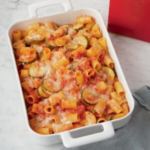Lidia Bastianich Instagram - Baked Rigatoni and Zucchini. Today you get zucchini year-round, so it’s easy to make this dish for the family at any time of the year. To balance it further, add some protein, such as swordfish, shrimp, crumbled sausages, or shredded chicken breast. You can add as little or as much of each ingredient to this recipe as you want, to satisfy your nutritional preferences and, of course, your taste. Buon Gusto!  Link to video and recipe in my bio. @granapadano  @centofinefoods 
.
.
.
.
.
 #centofinefoods #LidiasRecipes #LidiasItaly #LidiasKitchen  #granapadano  #ItalianFood #25YearsofLidia