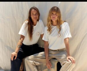 Lily Sullivan Instagram - Always up for supporting what @ellanoahbancroft_ is shaping in this world, this baddass boss babe and my long time sister has teamed up with the crew at @nagnata_ - a brand with an ethos of integrity and collaborating with local First Nations movements. 
The Tee features hand painted artwork and poem by artist @amarina.toby illustrating her connection to country. 

100% of the profits goes towards @the_returning_ founded by @ellanoahbancroft_ a Not-for-profit indigenous owned and run charity. 
Go buy one 😉

@nagnata_
@ellanoahbancroft_
@the_returning_
Artist @amarina.toby
Photographer @avanpodhajsky