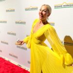 Lindsay Czarniak Instagram - Over a decade of marriage and I didn't know Telly was @craigmelvinnbc 's favorite muppet until last week. Grateful for this photo op and a special night celebrating all @sesameworkshop does to help with early childhood education. Congrats to @shondarhimes for the well deserved honor and thanks @aliceandolivia for creating a vibrant yellow gown (a la MY favorite Sesame Street character) that survived a LaGuardia airport bathroom wardrobe change with minimal wrinkles . We felt a little guilty singing along to some old favorites without the kids but this night was incredible! @sesamestreet #sesamestreet #kids #family #love #childhood #education