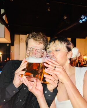 Lizzie Armanto Instagram - My 2023 highlight was @axelcrusher & I’s belated wedding party. Here's to making every moment count in 2024! Wishing everyone the best for the new year. 💍💒🎇