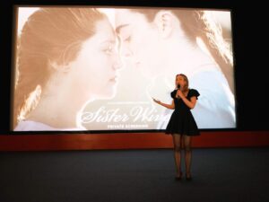 Louisa Connolly-Burnham Instagram - It’s been one whole week since the @sisterwivesfilm premiere & we’re finally floating back to down earth. Thank you to the 550  legends that came & supported us in a sold out @genesiscinema & to all the wonderful humans that made this film possible. We can’t wait to see where this journey takes us next 🩷👭✨

(sound on in the last clip for the audiences reaction as the credits started to roll 🥹) 

📸 @georgeontheboat 

#SISTERWIVES