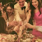 Louisa Mak Instagram – 唔少朋友都問我，哇搞三場婚禮，咪好辛苦！的確係，完事後直情要瞓足成個禮拜先recover到。其實唔係因為想搞到好「盛」大，而係源自於一個儘量make everyone happy嘅初心。

由於我和盛生好怕衝突、唔開心，所以我哋好早就決定將婚禮分幾次搞，而每一場都有各自嘅主角。大大小小嘅選擇就因住主角嘅需求而決定。

第一場盆菜宴，主角係老爺奶奶。我地盡跟圍村傳統，賓客絕大部份都係佢哋嘅親戚和朋友，而表演嘉賓方面，就邀請了奶奶很喜愛嘅李龍基先生。

第二場係正常擺酒，主角就係麥生麥太，菜式、流程、程序等都以佢地嘅意見為首。圍數全部歸佢地兩老，只受場地所限而唔使同對家協調😌 婚紗款色都迎合佢地喜好

至於第三場，就係更瘋狂嘅party，主角終於係我同盛生喇✌️因為之前已經take care 咗雙方父母嘅要求，呢次我哋就可以盡情選擇自己鍾意嘅嘢 – 戶外草地、樂隊歌曲、西式食物、無限酒精🫢… 爸爸媽媽雖然唔識欣賞，但係都好盡力去嘗試投入 😂 

呢個安排，幫我地避免咗唔少衝突。男女家唔使爭圍數、長輩和後輩唔使爭論食物和形式係中式定西式；頭兩場我和盛生安分守己地做好兒子和女兒的本分，再於尾場玩得好盡興🥳（盡興到啲相都唔出得街🤪)。咁壞處就係… 真係好攰🫠。

每人屋企都唔一樣，家家有本難念的經，以上純粹share下我倆嘅經驗。總括來講，我爸爸媽媽、老爺奶奶也是非常隨和，我們非常幸運，而最後似乎各人都開心。不過同時都提醒一句，家人話「冇咩所謂，簡簡單單就OK」呢句說話… ummm.. 千祈唔好盡信呀🤪唔知你哋又有冇啲咩婚禮後嘅insight呢？喺comment share吓吖！

最後，多謝 @agnesb_cafefleuriste 為三場婚宴都提供無限量超好食蛋糕😌 無論喺中式定西式婚宴、男家定女家、長輩定小朋友，蛋糕都一樣咁受歡迎😍

#勁甜麥

photo 1, 2, 5, 8 @taptsov_photography 
photo 4 @orbsproductionwedding 
photo 6, 7, 9, 10 @stein_image