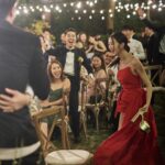 Louisa Mak Instagram – 唔少朋友都問我，哇搞三場婚禮，咪好辛苦！的確係，完事後直情要瞓足成個禮拜先recover到。其實唔係因為想搞到好「盛」大，而係源自於一個儘量make everyone happy嘅初心。

由於我和盛生好怕衝突、唔開心，所以我哋好早就決定將婚禮分幾次搞，而每一場都有各自嘅主角。大大小小嘅選擇就因住主角嘅需求而決定。

第一場盆菜宴，主角係老爺奶奶。我地盡跟圍村傳統，賓客絕大部份都係佢哋嘅親戚和朋友，而表演嘉賓方面，就邀請了奶奶很喜愛嘅李龍基先生。

第二場係正常擺酒，主角就係麥生麥太，菜式、流程、程序等都以佢地嘅意見為首。圍數全部歸佢地兩老，只受場地所限而唔使同對家協調😌 婚紗款色都迎合佢地喜好

至於第三場，就係更瘋狂嘅party，主角終於係我同盛生喇✌️因為之前已經take care 咗雙方父母嘅要求，呢次我哋就可以盡情選擇自己鍾意嘅嘢 – 戶外草地、樂隊歌曲、西式食物、無限酒精🫢… 爸爸媽媽雖然唔識欣賞，但係都好盡力去嘗試投入 😂 

呢個安排，幫我地避免咗唔少衝突。男女家唔使爭圍數、長輩和後輩唔使爭論食物和形式係中式定西式；頭兩場我和盛生安分守己地做好兒子和女兒的本分，再於尾場玩得好盡興🥳（盡興到啲相都唔出得街🤪)。咁壞處就係… 真係好攰🫠。

每人屋企都唔一樣，家家有本難念的經，以上純粹share下我倆嘅經驗。總括來講，我爸爸媽媽、老爺奶奶也是非常隨和，我們非常幸運，而最後似乎各人都開心。不過同時都提醒一句，家人話「冇咩所謂，簡簡單單就OK」呢句說話… ummm.. 千祈唔好盡信呀🤪唔知你哋又有冇啲咩婚禮後嘅insight呢？喺comment share吓吖！

最後，多謝 @agnesb_cafefleuriste 為三場婚宴都提供無限量超好食蛋糕😌 無論喺中式定西式婚宴、男家定女家、長輩定小朋友，蛋糕都一樣咁受歡迎😍

#勁甜麥

photo 1, 2, 5, 8 @taptsov_photography 
photo 4 @orbsproductionwedding 
photo 6, 7, 9, 10 @stein_image