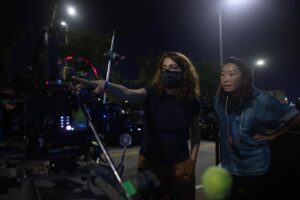 Lulu Wang Instagram - #Director Lulu Wang (@thumbelulu) and #DOP Anna Franquesa-Solano AEC (@annafranquesasolano) take us #behindthescenes of #Expats, shot with #Panaspeed lenses and serviced by #Panavision Woodland Hills.

Anna begins: 
“We wanted to capture a sense of restraint, since the three protagonists are constantly making an effort to not let go or surrender to their emotions, knowing that if they do, they will get lost. It is this attempt to keep control over their lives that influenced much of the visual look—subdued and constrained.”

Lulu continues: 
“Anna and I watched films together and also referenced photographers Michael Wolf and Christopher Anderson. We discussed how we’d visually represent this wound, this unseen thing. We also talked a lot about the contrast of the different worlds and spending a lot of time on the ground in Hong Kong gave us a lot of inspiration.”

Anna continues: 
“The reason why I went to Panavision for this project is because they have some of the best glass in the world and they were open to work with me to develop and find the look. The Panaspeeds gave us the control over the image that felt appropriate for the look. After performing some tests, Dan Sasaki modified them to be less sharp, softening the bokeh, controlling the flare to a minimum, and having very subtle glare around highlights, so we didn’t need any filtration during the shoot. 
We kept the look very clean, with no aberrations or flares to soften the reality that these women have to go through.”

Lulu concludes:
“The scale of EXPATS was far greater than anything I’ve done before, and it gave us a ton of runway to play with different visual languages and thematic ideas. It was important for us to be expansive without losing the intimacy or specificity for each character and their particular world. 

I became a director because I wanted to tell stories that transport you to another world and into another perspective. What keeps me inspired these days is collaboration. I love how collaboration expands my worldview and it helps me to continue learning and growing.”