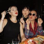 Madeleine Humphries Instagram – Red stockings, old fashions, and sushi with the Manila crew who are in town for the @manilaintlfilmfest 🍣🍣🍣