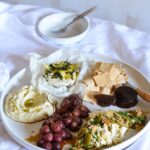 Maggie Beer Instagram - Graze the day away with a selection of moreish nibbles on a fulsome platter. Try this combination to delight your guests: - Baked Triple Cream Brie - Roasted Vino Cotto Grapes - Artichoke & Verjuice Dip - Crushed Olives with Ricotta, Almonds & Lemon Find these recipes via the link in our bio as part of our Make It a Maggie Easter eCookbook; simply join the Maggie Beer Food Club to receive your free copy (if you're already a member, find your eCookbook in the My Account section of the Maggie Beer online store). Tag a friend who you'd love to share this platter with! #makeitamaggieeaster #grazingplatter