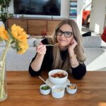 Maggie Lawson Instagram - When it’s chilly outside, we make chili inside 🌶️✨ A few years ago, my mom made me a scrapbook of all our favorite family recipes. Below, are the directions for my grandpa’s famous turkey chili. I hope you enjoy it as much as I do ❤️ ✨INGREDIENTS: Olive Oil Tomato Puree Tomato Paste Salt 1lb Ground Turkey 1 White Onion 3 cloves of Garlic 1 can crushed tomatoes 1 can Rotel 2 cans of beans (dealer’s choice) ✨GRANDPA’S CHILI POWDER: 1 tsp cinnamon 4 tsp coriander 1/2 tsp ground cloves 1 tsp chipotle powder 4 tbsp cumin 1 tsp chili powder 1/4 tsp all spice 4 tsp cocoa 1/2 tsp cayenne 2 1/2 tsp oregano ✨DIRECTIONS -Oil and salt a frying pan on medium heat. -Dice white onion and add to pan. -Let the onions brown before adding your turkey and garlic. -Once the meat has browned, add into a large pot with crushed tomatoes, tomato puree, tomato paste, 1 cup water, 1/4 cup olive oil, a can of Rotel, and 2 cans of your favorite beans (mine are kidney and pinto) -Season with Grandpa’s Chili Seasoning and stir together -Let mixture simmer on low heat, stirring occasionally ✨the longer it simmers, the better it tastes✨ -Serve with your favorite garnishes and enjoy! . . . ☝🏼Tap the link in my bio to check out my favorite cookware