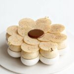 Maja Vase Instagram - Coffee pecan pavlova ☕️🌸 Light and crispy coffee meringue flower with a slightly chewy center, silky smooth coffee white chocolate chantilly, salted coffee pecan praline, and a glittering coffee chocolate flower ✨