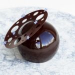Maja Vase Instagram - Cocoa mirror glaze RECIPE 🔮 Perfectly shiny and reflective as a mirror 💁🏼‍♀️ Save the recipe and drop a 💜, if you like it 👇🏻🙏🏻 6 leaves of gelatine (bloom value 240) 100 g heavy cream 50 g water 150 g caster sugar 150 g glucose syrup 50 g cocoa powder Soak gelatine in cold water. In a small saucepan, bring cream, water, sugar, and glucose syrup to a boil and remove from heat. Squeeze excess water from gelatine and stir into the warm cream. Sift cocoa powder into a plastic pitcher. Add the warm cream a little at a time and stir until combined. Sieve and hand blend. Let cool down to 35-38 ºC and pour over your frozen cake 🪄✨ Find the FULL RECIPE and all my best TIPS to nail the perfect cocoa mirror glaze in my app ‘Maja Vase’. Link in bio 💜