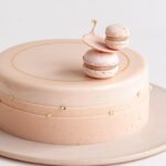 Maja Vase Instagram - RECIPE for you: Glittery strawberry champagne cake 🍓🍾 Pretty perfect for New Year’s Eve ✨ REKLAME / AD for @estatecoffee.dk #valrhona   Serves 8  CRUNCHY BASE 50 g Ivoire 35 % from Valrhona  20 g feuilletine 10 g popping candy a bit of lemon zest SPONGE CAKE 35 g sugar 1 egg 35 g flour 1/4 tsp baking powder CHAMPAGNE GELÉE 1/2 leaf of gelatine 35 ml reduced champagne CHAMPAGNE CREMEUX 1/2 leaf of gelatine 140 g Ivoire 35 % from Valrhona 2 egg yolks 15 g sugar 100 ml heavy cream 50 ml reduced champagne 10 ml lemon juice STRAWBERRY MOUSSE 1 1/2 leaves of gelatine 220 g Ivoire 35 % from Valrhona 100 g strawberry purée 10 ml lemon juice 220 ml heavy cream GLAZE 3 leaves of gelatine 75 g Ivoire 35 % from Valrhona  50 ml heavy cream  25 ml water 75 g sugar 75 g glucose syrup pink food coloring DECORATION  chocolate belts mini macarons chocolate decoration edible gold leaf DECORATION  chocolate belts mini macarons chocolate decoration edible gold leaf INSTRUCTIONS 👇🏻