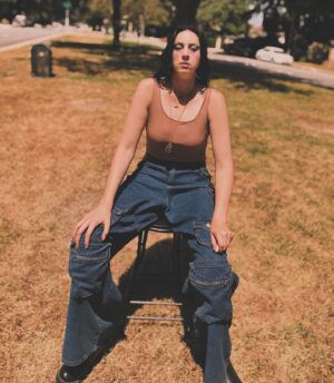 Maliah Arrayah Instagram - I’m just a simple country girl 👀🙂‍↕️ also, Happy June💚🫶🏼🥰. Happy Pride month🌈🫶🏼, Happy Summer Solstice (not quite but so soon omg😍), Happy Malia releases the first of 3 weird satirical poetry books called “shit I don’t say out loud”. Stay tuned 😏🤘🏼💥
.
In case anyone wonders where I get clothes to fit me 😂 
Jeans @fashionnova size 12 inseam 37😌
unitard @boohoo size 12 🫶🏼
Cropped Orange Blazer size 12 @boohoo 
Boots @amazonfashion size 13