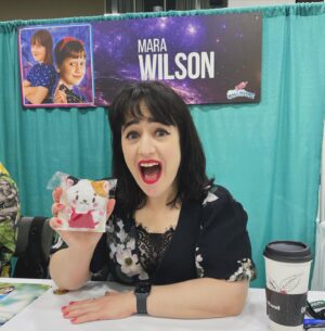 Mara Wilson Instagram - Fun at #GalaxyConColumbus! Hanging out with @kathleenherles (AKA Dora the Explorer), a cute stuffed cat, a truly creative Mrs. Doubtfire cosplayer, and an adorable dog named Sidney!