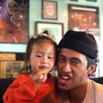 Mari Madrid Instagram - Keone, Keone, you’re 34. Can you believe it? 33 no more. Now it’s your Shaq year baby! Legendary Laker, 7’1”, Maybe if you keep drinking your protein… I think you’ll get there hon. Nah, sorry kid. The NBA wasn’t meant for you, you’ve got other fish to fry, they simply don’t have a clue. But really if I had a choice, Between Kevin Durant and you, I'd keep you on my team any day, ...Because let's be honest... we're 14 years into our relationship and I still don't know that much about basketball - it's true. I will choose you every time, You're my favorite Pokémon, You're so tentacool and not tentacruel, A ninetail with the beauty and the brawn. To say I am proud, Or to say that I’m in love, Wouldn’t do you justice, Because you’re a gift from above. Watching you grow over the years, Is one of my favorite things, From crush to boyfriend, finance, husband, co-parent? Unending joy it brings. But really my favorite is just being friends, You still make laugh with your jokes, You still crack me up with your weird scream mask face, And talk to me in Anchorman quotes. You’re the Mindflayer to my Vecna. Or the Vecna to my Mindflayer? Either way Numah’s our little Demogorgan, Let’s just raise her to be a cosplayer. She’s probably too cool for that. Let’s just raise her to be 11 y’all, We can trap her in a creepy government facility and do tests on her, That won’t backfire at all! But you really are my favorite, Driven like Nancy Wheeler - that debonair, As badass and honest as Max, And as beautifully unkempt as Steve Harrington’s hair. You make me happy like Dustin and Suzie, singing the theme song to Never Ending Story, You complete me both here AND in the Upside Down, Our lives are never boring. (And when they are it's perfect.) *A moment of silence for Barb.* All of these pop-culture references to say, You're simply the best, Do you hear Tina Turner in your head now? Better than all the rest. (You also know how to install a faucet. Super hot.) I love you. Happy Birthday.
