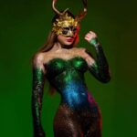 Marina Valmont Instagram - All that glitters isn't gold but it could be 😏 Bodypaint by the internationally renowned artist and reality TV star 🎨@fernello @alxguzmanphotography #cosplay #art #bodyart #ibiza #artistsoninstagram #bodypaint #spain #glitter #mask #skinwars #avantgarde #costumeparty #sexy #saturday #partydress #curves #marinavalmont
