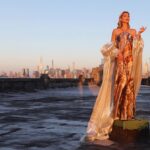 Marla Maples Instagram - ✨💛 Feeling Golden 💛✨ Thank you once again @fadilberishaphotography for always making me feel like a Queen! May we always shine the Light of Love above all else. #fadilberisha #marlamaples #NewYork #skyline #shine #riseaboveyourfears #fashion #over50 #modelpose 😂