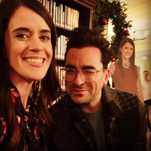 Mary Holland Instagram - Thank you to everyone who has watched Happiest Season! 🥰🎄And thank you for all the love for Jane! Your messages have been so meaningful to me. Here’s a pic of John (the wondrous Dan Levy), Jane, & my own personal cardboard cutout of myself that I insist on bringing with me wherever I go. #happiestseason