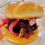Mary Padian Instagram – #Repost @dwpbbq ・・・
Great times today @chefsforfarmers main event. Got crazy with food, ran into so many friends, while keeping a steady paced line for 4 hours…
must have been the wagyu beef belly slider with candied pork jowl bacon, pickled red onions and nanna peppers..compliments of @a.bar.n.ranch and @rehoboth_ranch . Can’t thank @mike_sharp88 for all his hard work today… And welcome back to D town @marypadian #chefsforfarmers #dallaseats #dallasfoodie #sundayfunday @ferriswheelers @iris_midler_mccallister