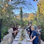 Mary Steenburgen Instagram - Grateful. Backs turned as everyone heads for food. Please do zoom in on my centerpiece( my longtime friend Linda ( navy dress) helped me put it all out). And my three granddaughters did the place cards. We all made the yummy food. Hope you all had a blessed day. 🧡