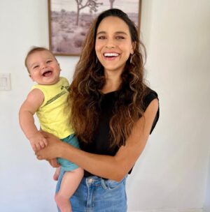 Maya Stojan Instagram - My baby boy is 8 months old today! Someone please press pause on time. My heart continues to grow wider than I could have ever imagined. 
His silliness, his playfulness, the way he discovers each moment as a golden opportunity. 
He laughs at my dumb jokes as if I’m some hot upcoming comedian. 
He only likes adult things, keys, spatulas, remotes, wallets, no baby toys for this guy.
Will army crawl miles if it means getting a grab of his favorite creature, our dog Winston. 
Eats exactly the way I eat, like there’ll never be enough. 
But boy is his little heart full and so is mine. 
#myminime