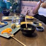 Meagan Tandy Instagram – Num Num. Had a much needed catch up lunch with two of my favs. We went to this new spot  @sushipalacehollywood 💃🏽 The vibe inside the place was 🔥 The staff was 🔥 and my favorite, the Toro belly Nigiri, as per usual,  insane 🔥. The gyoza [[insert chefs kiss here]]. The best part? Enjoying the cuisine with @nationsfilm and @dottidol . Who woulda thought a wolf show would bring about some of my dearest friendships and connects ❤️ ✨