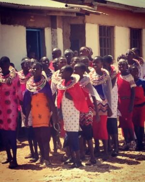 Megalyn Echikunwoke Instagram - Day 2 in Kaijado at Sanare/Arroi primary school. Ahhh! Well besides the fact that when I asked to sit down and take  a picture with them I broke their bench, crashed to the ground and they all pointed and laughed for which I could hardly blame them, they also have a glorious choir that performed for us AND are educated about the impotance of effective hygiene practices to prevent communicable diseases like trachoma through @amrefhealthafrica “WASH” program which is part of the community water project from my stories. These little plastic jugs “tippy taps” tied to trees or hand and face washing stations fueled by the community water pump ensure that these kids dont get sick and can stay in school. In the first video they are welcoming me “Karibu!” (even though I broke their bench)  telling you who they are and saying “hi to USA!”