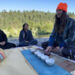Melissa O'Neil Instagram - Before a day off, a group of us brought our sleeping gear down to the river for the night. It almost didn’t happen. But it did! In the dark, we schlepped a wagon full of water and tea schtuff down a very steep hill. @mugen___________ brought incense to share with everyone and then we all laid there, staring up at the stars, trying to recall what @lindsey12wei had shared the night before, seeing what else there was to witness… ♾️🤙🏼. Eventually we fell asleep, burrowing deeep into our sleeping bags. It got chilly at night. In the morning this beautiful mist lingered over the river - all of our gear was damp. As quietly as I could, a little tea space started to come together as everyone slowly woke up. We had some casual tea until the sun was blazing. There was a curious bluejay bouncing around as everyone stayed bundled up with their layers and their tea. That was an awesome night and morning. I’m so glad it happened. And that Felix and SK got some snaps of it. 🥰 I absolutely treasure @cedarbloomfarm- filled with spaces both adorned and left bare to discover and create magic in. Thank you @daughterofthesun_ for hosting us. 🥹