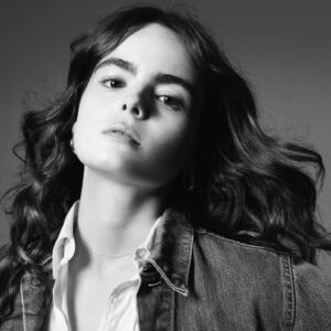 Micaela Wittman Instagram - @hedislimane x @vmagazine 
Honored to be 1 of 3 young women chosen for Hedi Slimane’s “The Next Act” Series. 
—
“When Micaela Wittman got her driver’s license, her first destination wasn’t the mall or a local drive-thru, it was a talent agency. Growing up in a highly religious home in Arizona where acting was all but forbidden, much of the actress’s first foray into the business was done in secret. Now, three years later, Wittman is done hiding her star power. Her first film role in the 2021 mockumentary Clairevoyant saw her as the lead, as well as a co-director and screenwriter on the project, corroborating her industry dreams. “Being a nobody and deciding Hollywood would be a better place with you is a bold stance to take, but we all go in with this blind confidence in ourselves,” recalls Wittman. “Clairvoyant taught me that I wasn’t crazy, and I actually deserve to be here.” Now, 23 years old, the starlet continues to hit her mark with her latest project Remy & Arletta, a coming-of-age story that she describes as “two best friends who learn to love each other selflessly.” Whether it be for her inspirational work in front of the camera or her contemplative time spent behind it, Wittman is primed for success—no secrets about it.”