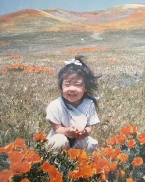 Michelle Kim McCoy Instagram - Super Bloom Pt. 2 {SWIPE} || When my mom sent me this photo of me as a good little Korean squinting and squatting in Lancaster over 25 years ago I knew I had to go back during #dluxsabbath to recreate the image. My mom’s favorite pastime was taking photos of me with flowers. We had many a photoshoot in our own personal rose garden and you better believe that whenever there was a fresh bloom in sight, we would pull over for an obligatory photo. I’m pretty sure I hated it as a kid but I’m also convinced that this is why I have chosen the career path I have 😅 Mom always said, “You’ll thank me one day”...and sure enough, the moral of the story is: Mom is always right 🤦🏻‍♀️
.
.
.
.
.
.
#neverstopexploring #welltraveled #alifetolive #wanderfolk #letsgosomewhere #getlostclub #alwaysadventure #thatsdarling #darlingmovement #thehappynow #livethelittlethings #liveauthentic #loveauthentic #livefolk #artifactuprising #theeverydayproject #peoplescreative #thepursuitofjoyproject #nothingisordinary #vscodaily #creativehappenings #superbloom