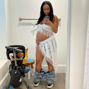 Michelle Mitchenor Instagram - INT: MALL DRESSING ROOM. Pregnant mom ventures out w/ cranky toddler & big ol belly to try clothes on as quickly & as swiftly as possible w/out bending over to take off jeans & shoes b/c she has 5 minus T seconds be4 her toddler explodes.🫣🤣 😂😂 Yah do what yah gotta do in these muvahHOODstreets 

#muvahood #twopieceloading #8months #pregnant 

Also @doonausa is one of my fav brands! Esp as a traveling working muvah I mean it’s a MUST have if you not tryna lug one of those Cadillac strollers. This trike and the car seat/stroller are definitely getting passed down! Too bad they don’t have a double stroller thooo 🥹🥹🥹
