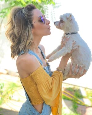 Michelle West Instagram - All dogs go to heaven and I guarantee this one pranced in there and took over the place! 😆 Jk, but not really! Yesterday was hard, harder than I had ever imagined and I DREAD a post like this because my face is blanketed with tears trying to write it but I have to give my girl the respect she deserves because if you knew me or Dean, you LOVED Roxie! My heart breaks to say that, after 17 years, we had to say farewell to her yesterday but it’s also at ease knowing that she went at home in our arms, hearing our voices during her last breath, and that she is no longer in pain and resting easy! A piece of my heart will always be with her and if you knew her/us, you know that! I’ve had her for literally almost half of my life, during a lot of learning years, so she was there for me a lot without even knowing but also knowing! She’s traveled more than some humans. Loved road trips, flights as my “therapy” dog 😂, shopping in Santa Monica on the promenade 😆, beaches, parks, and anywhere I was 😆. She was always one step behind me. She chose Dean 🥰. She laid on my belly anytime she could when I was pregnant with Charli and never left my side when I was sick during it! Then, she surprisingly, kindly, gave up her spot for Charli to sleep there. She even dealt with Charli carrying her non-stop in her final weeks and I thank her for that because it made Charli so dang happy. She had her favorites and she was our fave 😆. The dog with no rules and the one who led the pack! She let you know instantly if she liked you and literally chased down Great Danes at the park because her confidence was the size of one! She was a feisty one but also such a loving one and I’m going to miss that little love so dang much. It’ll take some getting used to, for sure, but I think she’ll send me signs and I’ll see her on the other side one day! RIP Roxie Michelle West, Nugget, Squirt, Little Toot, Little Boo, and the best one of all, Caca 😂. When Charli started to talk that’s how she said Roxie and it just stuck 🥰🥰. I love you, little boo, fly high and rest easy!