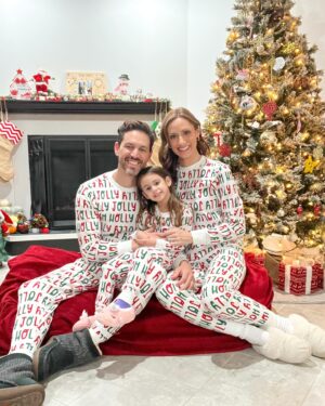 Michelle West Instagram - “Merry Christmas Eve Eve” IYKYK 😆 With a hectic few weeks, we didn’t manage to get the pics I envisioned yet but these put a smile on my face and we had fun while capturing them! Bernie on the other hand, over it 😂

#matchingpajamas #familyfirst #christmaspajamas #positiveinfluencer #teamwest #familymatching