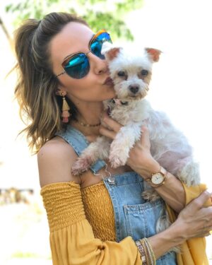Michelle West Instagram - All dogs go to heaven and I guarantee this one pranced in there and took over the place! 😆 Jk, but not really! Yesterday was hard, harder than I had ever imagined and I DREAD a post like this because my face is blanketed with tears trying to write it but I have to give my girl the respect she deserves because if you knew me or Dean, you LOVED Roxie! My heart breaks to say that, after 17 years, we had to say farewell to her yesterday but it’s also at ease knowing that she went at home in our arms, hearing our voices during her last breath, and that she is no longer in pain and resting easy! A piece of my heart will always be with her and if you knew her/us, you know that! I’ve had her for literally almost half of my life, during a lot of learning years, so she was there for me a lot without even knowing but also knowing! She’s traveled more than some humans. Loved road trips, flights as my “therapy” dog 😂, shopping in Santa Monica on the promenade 😆, beaches, parks, and anywhere I was 😆. She was always one step behind me. She chose Dean 🥰. She laid on my belly anytime she could when I was pregnant with Charli and never left my side when I was sick during it! Then, she surprisingly, kindly, gave up her spot for Charli to sleep there. She even dealt with Charli carrying her non-stop in her final weeks and I thank her for that because it made Charli so dang happy. She had her favorites and she was our fave 😆. The dog with no rules and the one who led the pack! She let you know instantly if she liked you and literally chased down Great Danes at the park because her confidence was the size of one! She was a feisty one but also such a loving one and I’m going to miss that little love so dang much. It’ll take some getting used to, for sure, but I think she’ll send me signs and I’ll see her on the other side one day! RIP Roxie Michelle West, Nugget, Squirt, Little Toot, Little Boo, and the best one of all, Caca 😂. When Charli started to talk that’s how she said Roxie and it just stuck 🥰🥰. I love you, little boo, fly high and rest easy!