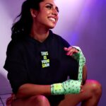 Michelle Khare Instagram - Y’ALL!! We are SOLD OUT of our custom stars and sparks black and blue hand wraps!! We STILL have a few of the green and purple avail 👀 grab ‘em before they get knocked out! 🥊 Still so blown away by the support for our apparel with @seek.discomfort and I am so in awe of all of you for taking on boxing as a challenge of your own!!! 🥹