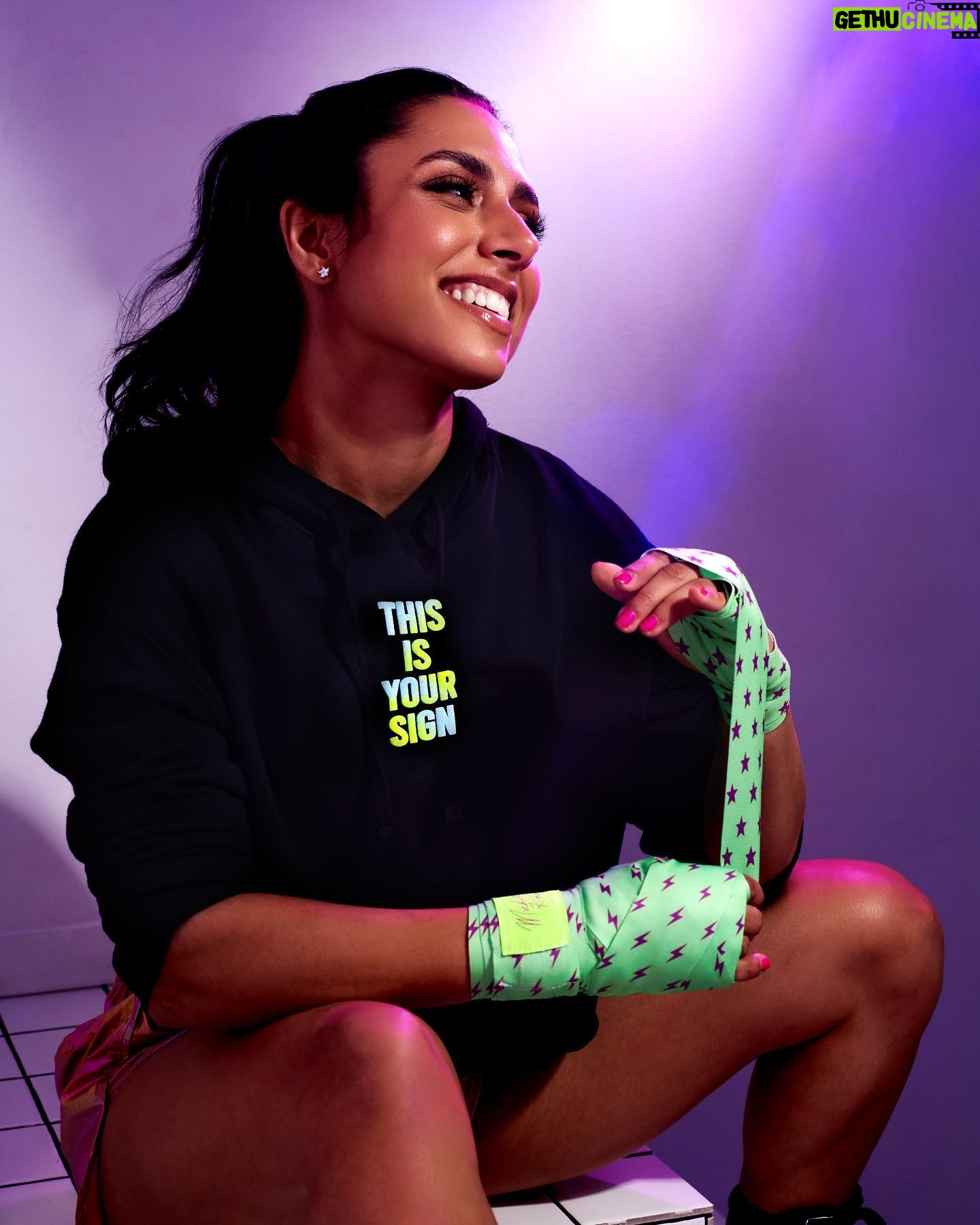 Michelle Khare Instagram - Y’ALL!! We are SOLD OUT of our custom stars and sparks black and blue hand wraps!! We STILL have a few of the green and purple avail 👀 grab ‘em before they get knocked out! 🥊 Still so blown away by the support for our apparel with @seek.discomfort and I am so in awe of all of you for taking on boxing as a challenge of your own!!! 🥹