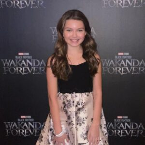 Mila Harris Instagram - 🎥🍿So much fun at the premiere of Black Panther 2 Wakanda Forever 🤍 Thank you @disney @marvelstudios for an amazing film and an awesome evening! 🌟🖤 #blackpanther #wakandaforever #disney #marvel #redcarpet #made #in #georgia #atlanta #film #legendary #amazing #actors #brilliant #storytellers #mustsee #theater #cinema #comingsoon #black #panther #rules #remember #chadwickboseman #forever #love #life #movie #magic @paradigmtalentagency @jenjen2010 @shanellegray @mvpsem