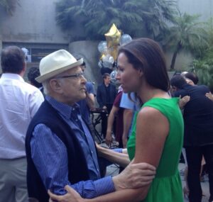Minnie Driver Instagram - One of the great privileges was knowing you. This picture was taken when I was the musical act at your 90th birthday party. I started late, on the wrong note and never quite made any ground back up the whole rest of the set … I was so embarrassed and sorry at the end and you grabbed my arms and said “ That’s jazz baby, and I enjoyed watching you try to play through it”
How lucky we all were to have you for so long..
So long Norman ! We love you. #normanlear