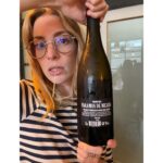 Molly Bernard Instagram - dressed as French, drinking Spanish wine, eating a Greek olive in Dublin waiting on delectable gluten free Irish fish and chips as captured by Instagram husband @liebhan