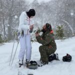 Molly C. Quinn Instagram - Yesterday, while Elan, our friend Peter, and I were having an amazing ski day in the mountains of Hokkaido, Japan, Elan suggested we take a photo to commemorate the trip. Something he always makes sure to do. But then, things started to get odd. He was taking off his skis... and helmet... and looking at me with a mixture of total love, fear, and vulnerability. I turned to see what was taking Peter so long because I was freezing and refusing to take any gear off... and I see Peter, also with skis off, running into the middle of the slope with his phone out. I turned back to Elan, he reached his hand into his inside jacket pocket, I screamed “NO!” Elan helped me take my helmet and gloves off, he got down on one knee, and I said “YES!” at least a hundred times. I am still surprised and in awe of the perfection of the moment. I am in love and we are ENGAGED!