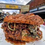 Molly McCann Instagram – ☘️ PADDY’S WEEKEND SPECIAL ☘️ McCann’s Guinness Beef Sub 🤌🏻

Braised beef shin in a Guinness gravy, with garlic and herb butter crispy potatoes, jammy Guinness onions and confit garlic and parmesan aioli served on a homemade sub 🤩

Available Saturday & Sunday @balticmarket 💚🍀