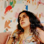 Mona Chalabi Instagram - Thank you @time for naming me in your 100 next list. Just patiently waiting for everything to go wrong because these past few months have been a bit too fruity. Photo by @heathersten of me wearing my mum’s dress in front of a painting in progress.