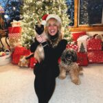 Morgan Huelsman Instagram – our first family picture since Hazel’s adoption (do you know how hard it is to get a pic with a cat?!?!) & her very first Christmas with us!! 🥹 Remi being adorable, per usual. merry christmas && happy holidaysssss