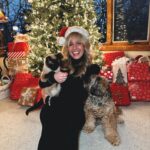 Morgan Huelsman Instagram – our first family picture since Hazel’s adoption (do you know how hard it is to get a pic with a cat?!?!) & her very first Christmas with us!! 🥹 Remi being adorable, per usual. merry christmas && happy holidaysssss