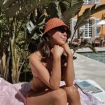 Naomi J. Ogawa Instagram - Lately I’ve been dealing with a lot of anxiety. Which isn’t fun! I had to take a break from the pod but I promise I will be back soon with a new ep! I can’t stress enough how important it is to take care of yourself! Sometimes in the middle of life’s madness, it’s important to reconnect to things that spark joy 🧡 (like this bucket hat) 🤭