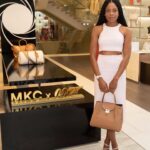 Naomie Harris Instagram - What a whirlwind the last 48 hours have been! Flew to London to visit the Regents Street flagship @michaelkors store, and help with the launch of the fabulous #mkcx007 Bancroft bag! Then stopped by the pop up @omega store at the Burlington Arcade to preview the latest collection of Bond related watches! A quick outfit change and onto the red carpet for the Bond premiere! Followed by a few hours sleep and back on a plane to Spain to continue filming! Mental! But soooo much fun! Thank you @michaelkors for the stunning outfits, and thank you @omega for always providing the perfect accessory for any outfit!! Photographer credits: @mikemarslandphotos @johnallenphillipsphoto